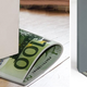 Illustration for article titled Steady Wobbling Tables with Wads of Fake Cash